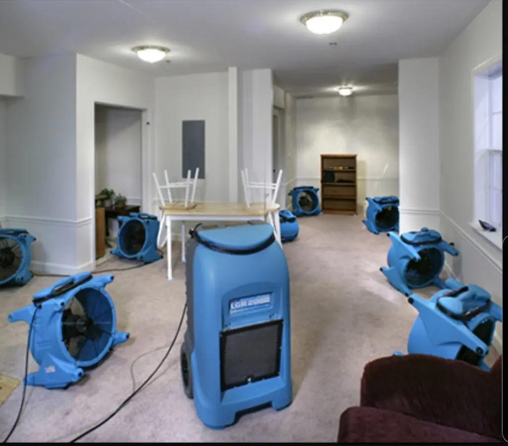 Air movers and dehumidifier setup for Water Damage Restoration in Manvel